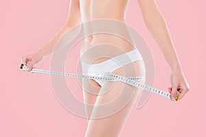 Cosmetology liposuction weight loss concept. Cropped close up photo of ideal perfect woman's body in cotton