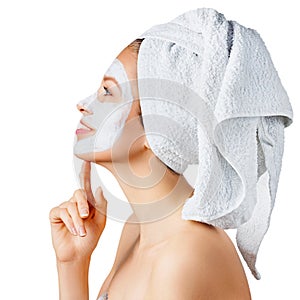 Cosmetology, skin care, face treatment, spa and natural beauty concept. Woman with facial mask photo