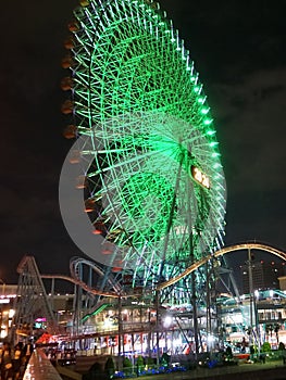 Cosmo World amusement park has a handful of roller coaster rides and a large Ferris