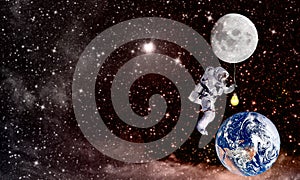Cosmonaut and lighting planet Earth.mission in outer space