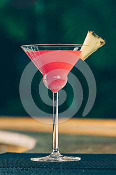Cosmopolitan cocktail at the bar stand. Luxury vacation concept
