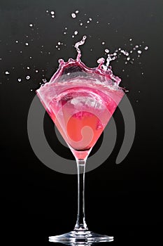 Cosmopolitan cocktail drink on a black