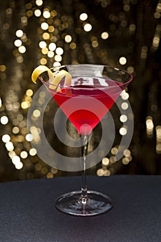 Cosmopolitan cocktail with lemon garnish