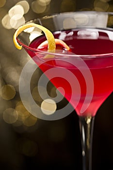 Cosmopolitan cocktail with lemon garnish