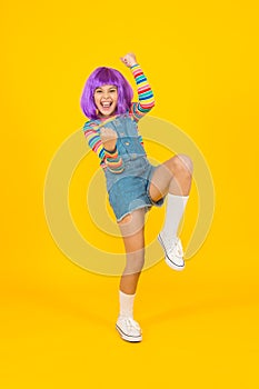 Cosplay character concept. Culture hobby and entertainment. Cosplay outfit. Otaku girl in wig smiling on yellow