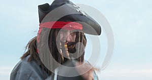 Cosplay, image of cute pirate in hat with dreadlocks, mustache, beard