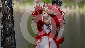 cosplay show and theatrical performance, blonde woman is wearing medieval fairy tale dress