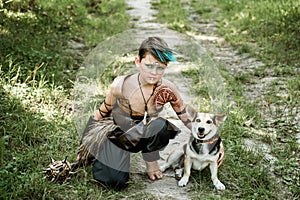 cosplay of Ukrainian Kozak. Cute Caucasian boy holding mace with emblem of Ukraine pretending to be fearless warrior