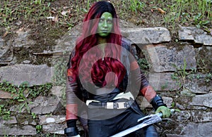 Cosplayer girl dressed as Gamora, member of the Guardians of the Galaxy and character from the Marvel Comics series.