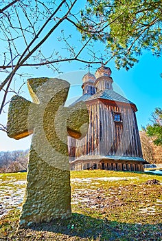 The Cossack grave stone and old wooden church of St Michael, Pyrohiv Skansen, Kyiv, Ukraine