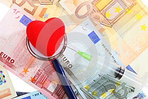 Cost of health care: stethoscope red heart on euro money