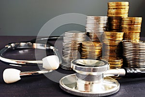 Cost of healthcare. Stethoscope and money.