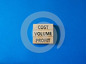 Cost Volume Profit symbol. Concept word Cost Volume Profit on wooden blocks. Beautiful blue background. Business and Cost Volume