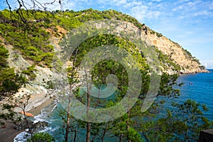 Costa Brava landscape on Begur coastline overlooking bay and rocky cliff photo