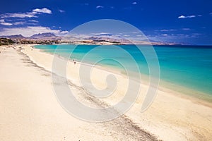 Costa Calma sandy beach with vulcanic mountains on Jandia peninsula, Fuerteventura island, Canary Islands, Spain.