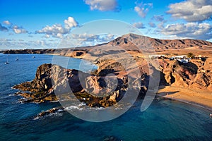 Costa de Papagayo on a sunny evening. The mountain range Los Ajaches in the background. Lanzarote, Spain