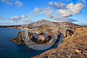 Costa de Papagayo on a sunny evening. The mountain range Los Ajaches in the background. Lanzarote, Spain