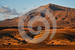 Costa de Papagayo at sunset. View to the mountain range Los Ajaches. Lanzarote, Spain