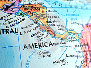 Costa Rica Central America focus macro shot on globe map for travel blogs, social media, website banners and backgrounds.