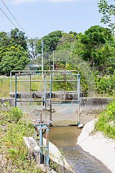 Costa Rica, metal sluice of an irrigation canal