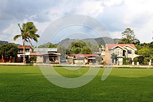 Costa Rica soccer field with houses in the back side