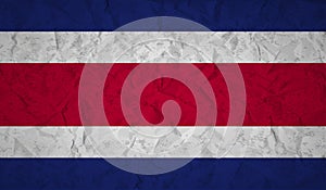 Costa Rican flag with the effect of crumpled paper and grunge