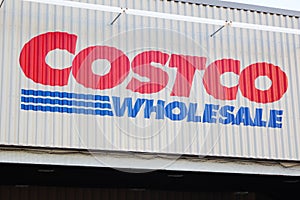 Costco Wholesale shopping center exterior with closeup of company logo