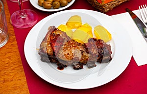 Beef rack with potato and olives photo