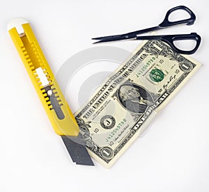 Costing depicted by a cutter and scissors photo