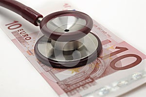 Costs and revenues in the health sector with euro banknote