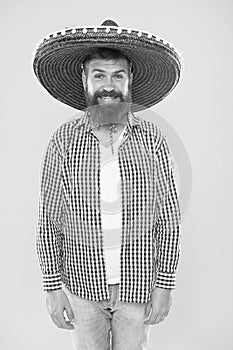 Costume accesory. Bearded man in mexican hat. Mexican man wearing sombrero. Hipster in wide brim hat. Traditional