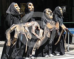 Costumed marchers in anti-war parade