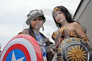 Costumers roleplaying Captain America and Wonder woman