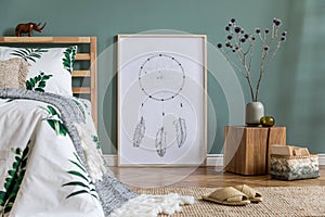 Cosy bedroom interior with natural boho accessories and large mockup poster frame.