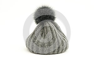 Cosy grey soft cap with bob on white background