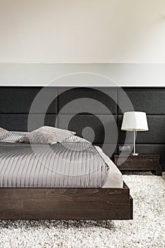 Cosy light bedroom with fluffy carpet