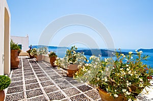 Cosy patio with flowers in Fira town on the island of Thera(Santorini), Greece.