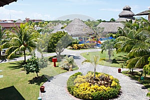 Cosy top view of a hotel inner yard with paths, flowerbeds, playground, Varadero