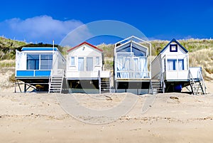 Cosy vacation homes standing along the coastline. Summer concept. Vacation rentals. Retreat. Spring. Nature therapy.