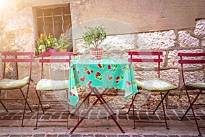 Cosy vintage cafe terrace in a street of Cassis on the French rivieria France