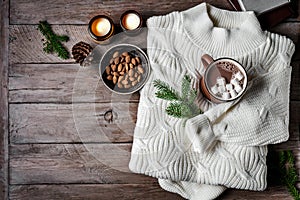 Cosy winter background with cofee, sweater and candles