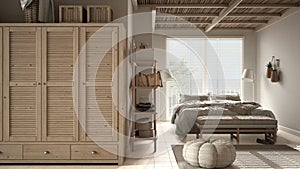 Cosy wooden peaceful bedroom in beige tones, double bed with pillows and blankets, ceramic tiles floor, carpet, pouf, shelves, big