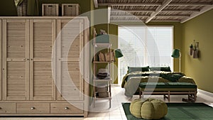 Cosy wooden peaceful bedroom in green tones, double bed with pillows and blankets, ceramic tiles floor, carpet, pouf, shelves, big