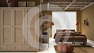 Cosy wooden peaceful bedroom in orange tones, double bed with pillows and blankets, ceramic tiles floor, carpet, pouf, shelves,