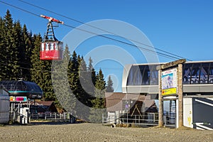 Red cable car transportation at Cota 1400m station in Bucegi Mountains, Romania