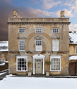 Cotswold house in snow photo