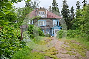 Old wooden house with an attic photo