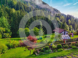 cottage at the base of the mountain in the meadow