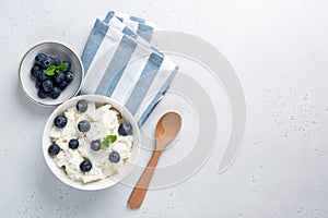 Cottage cheese with blueberries in bowl