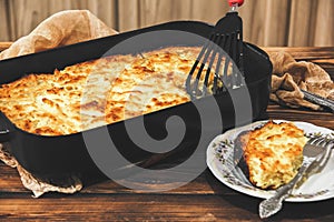 Cottage cheese casserole on a baking sheet. Homemade pie. Dessert. Serving the dish. Foodphoto